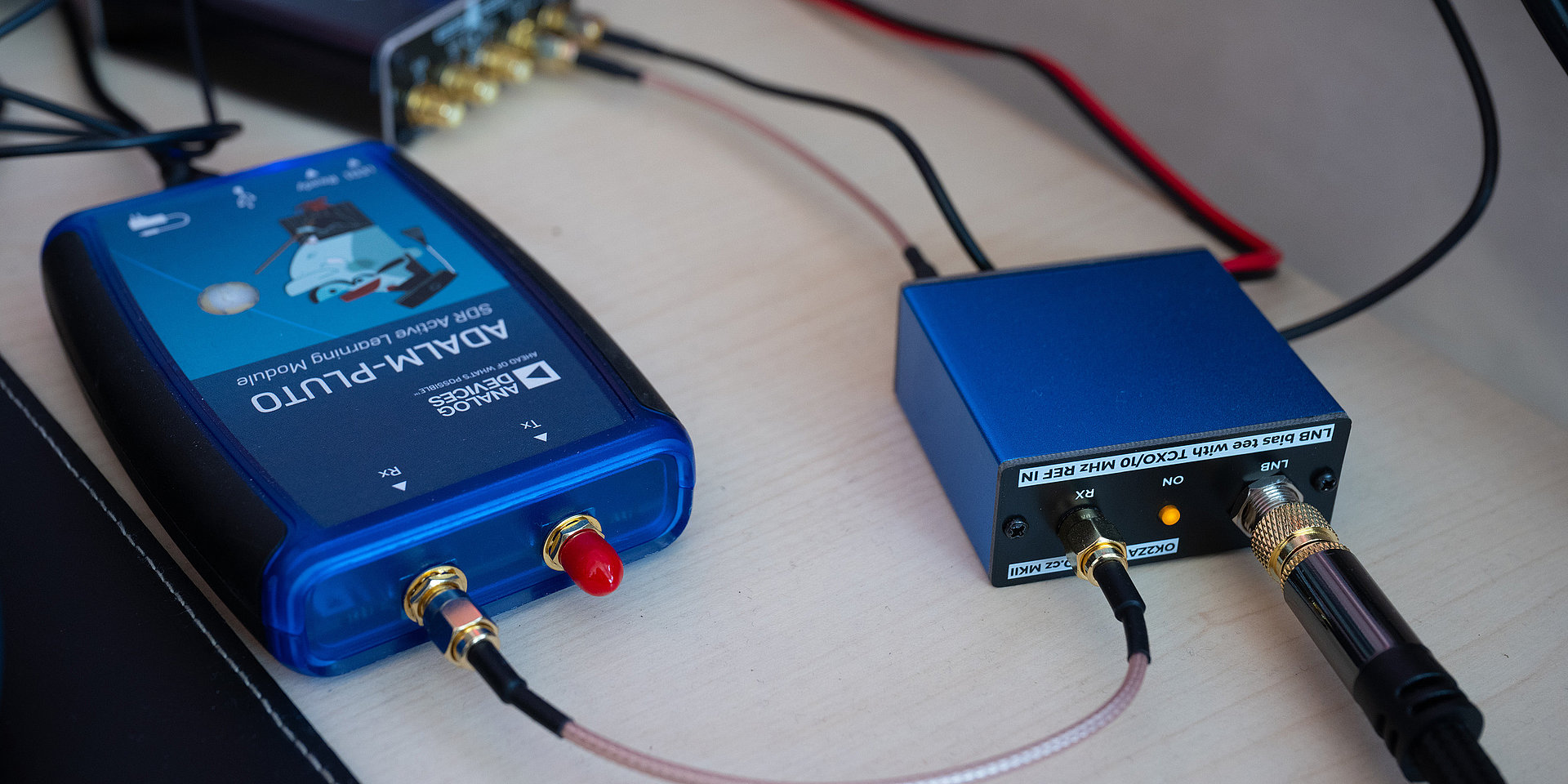 The various electronic components of the radio station are connected by cables. 