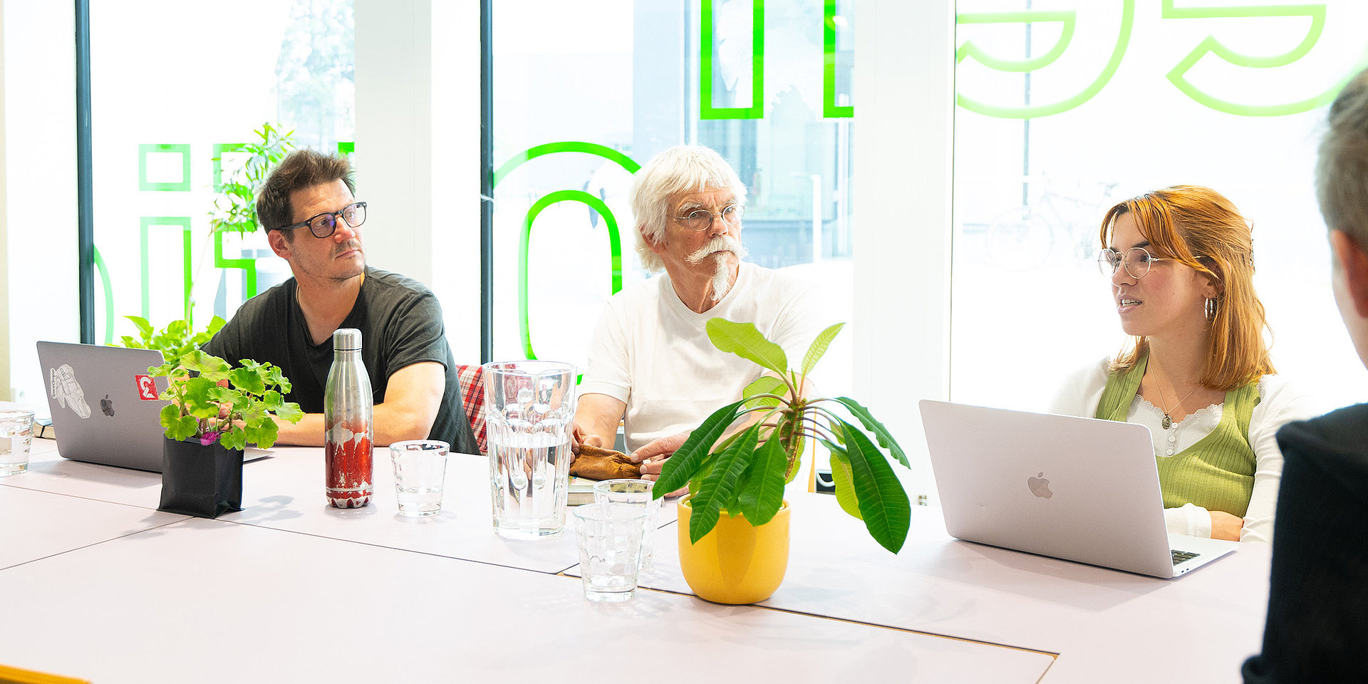 Dr. Torsten Schäfer sitting at a table with four other people.
