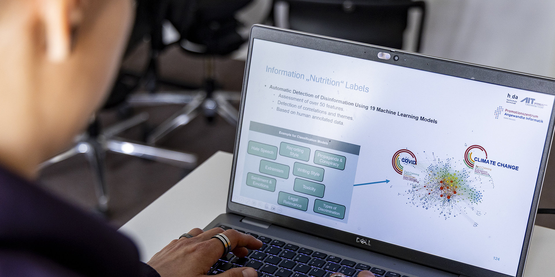 A researcher analyzes data on a computer.
