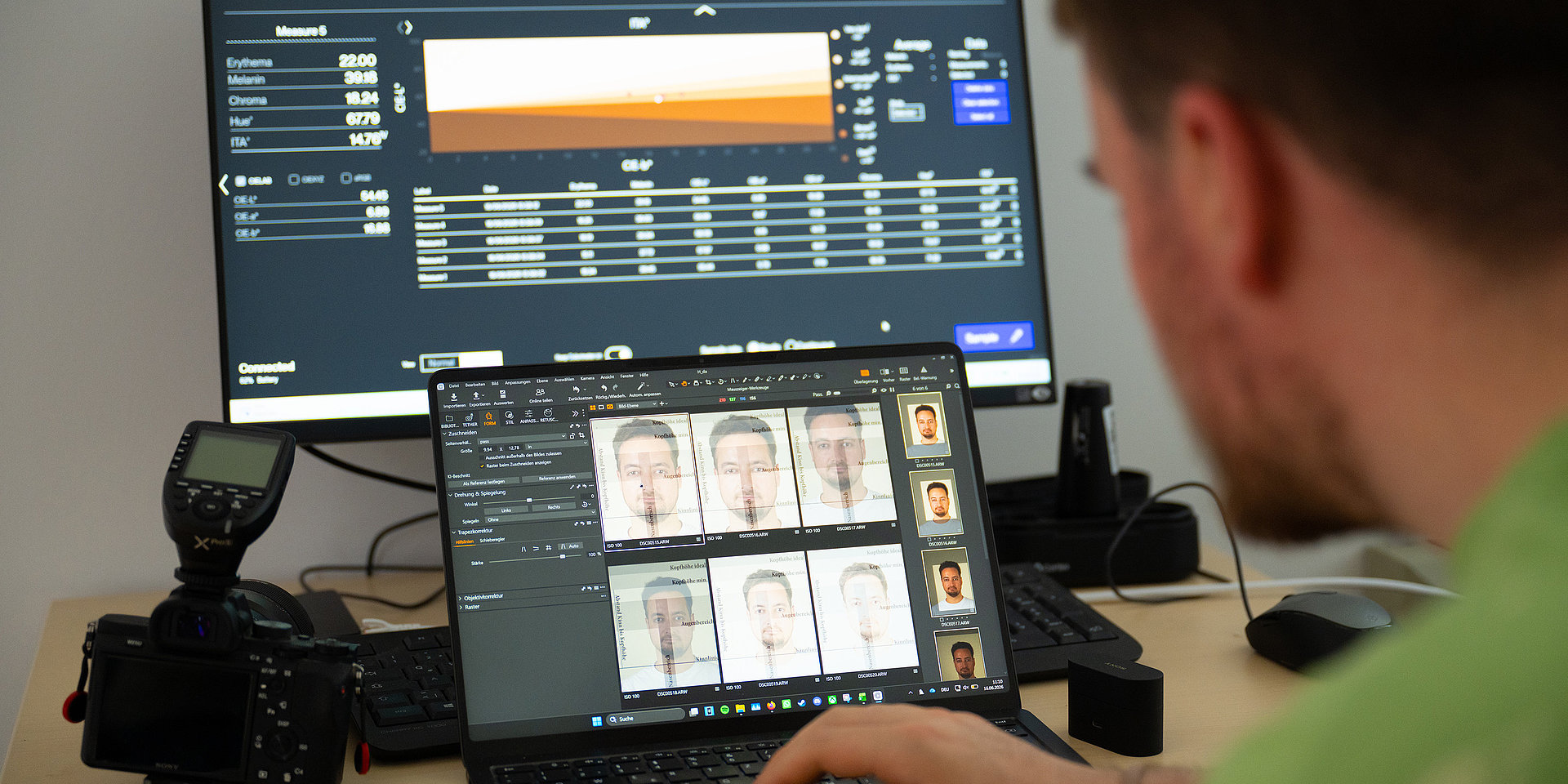 Using a program, Paul Kibler checks to see how well the photo turned out and whether it meets passport photo standards.