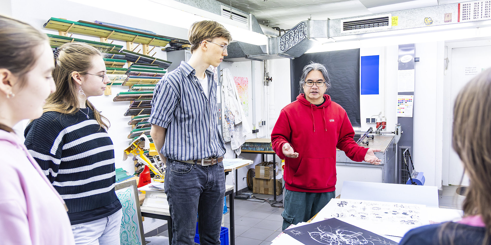 Students in the screen printing workshop at the Department of Design.